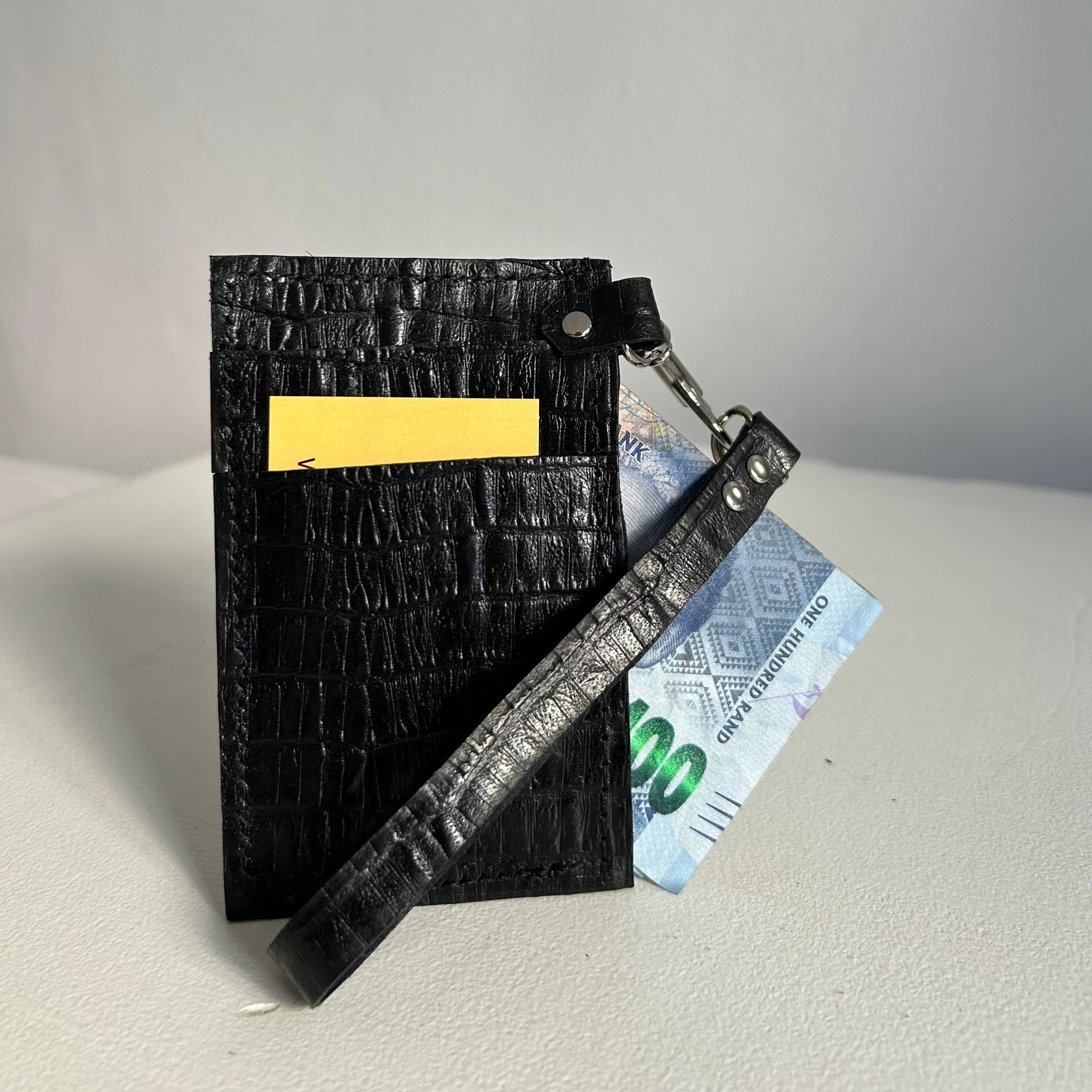 Black leather card and cash wallet with hand strap