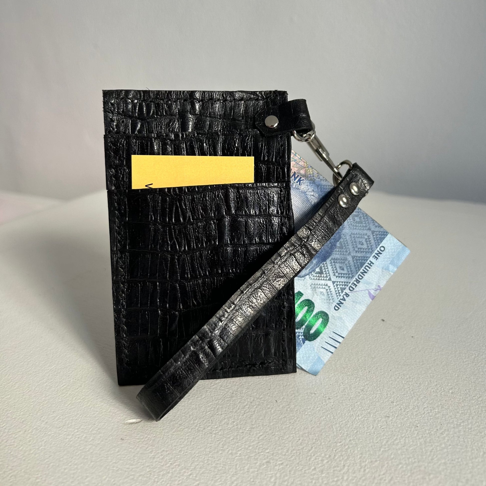 Black leather card and cash wallet with hand strap