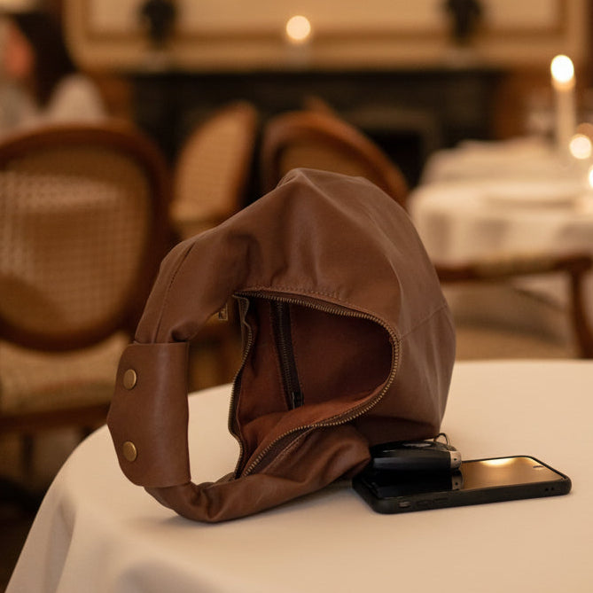 Brown leather zip bag open showing internal size